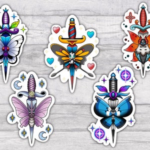 May include: Five colorful stickers featuring a dagger with a butterfly design. Each sticker has a different color scheme and butterfly design. The stickers are perfect for adding a touch of whimsy to laptops, water bottles, or journals.