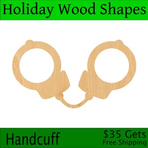 May include: Wooden cutout of a pair of handcuffs. The cutout is made of light brown wood and is ready to be painted or stained.  Handcuff.