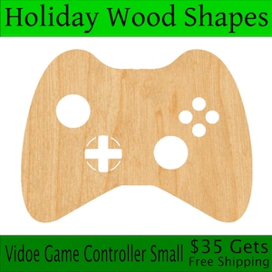 May include: A wooden cutout of a video game controller. The controller is light brown and has a white design. The text "Video Game Controller Small $35 Gets Free Shipping" is at the bottom of the image.