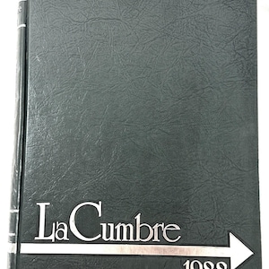 May include: A dark green yearbook with the words "La Cumbre" in silver lettering and the year "1988" below. The cover has a textured, leather-like appearance. The spine is also dark green with silver accents.
