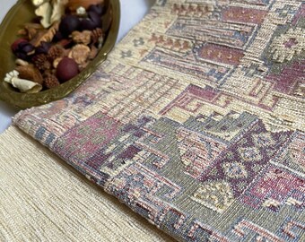 May include: Two pieces of fabric, one with a beige and brown geometric pattern and the other with a beige, brown, and blue geometric pattern.