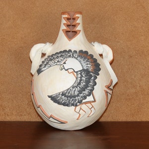 3D Eagle Dancer pot by Pecos. Jemez Pueblo, The Eagle Dancer and feathers are actually raised from the Canteen Surface