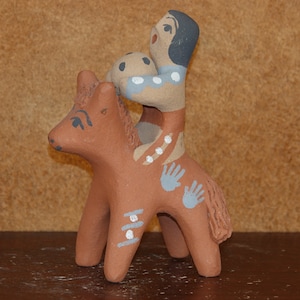 Little boy with a ball on a painted pony storyteller, Signed FF, Jemez Pueblo