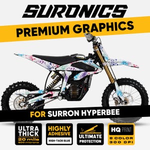 May include: A SurRon Hyperbee electric dirt bike with a white, black, and colorful splatter design. The image includes the text "SURONICS PREMIUM GRAPHICS" and details about the product's thickness, adhesive, and print quality.