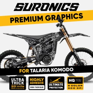 May include: Motorcycle graphics kit in black and white, designed for the Talaria Komodo. The design includes various logos and text, such as "Red Bull" and "Rock Sox". The kit is described as ultra thick, highly adhesive, and offering ultimate protection.