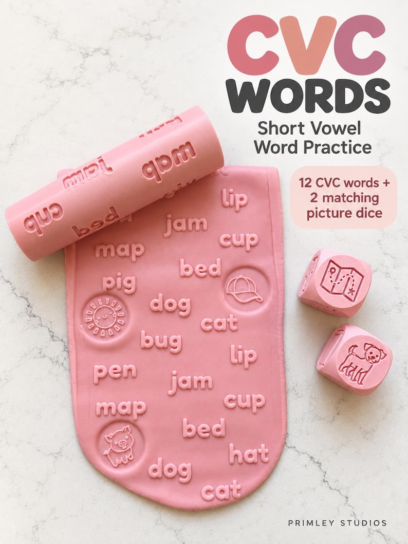 May include: A pink rolling pin and a flat pink mat, both embossed with CVC words and icons, alongside two pink dice featuring illustrations. The text reads CVC WORDS Short Vowel Word Practice, 12 CVC words + 2 matching picture dice, and PRIMLEY STUDIOS.