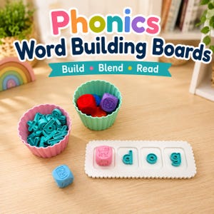 May include: A phonics word building set featuring a white rectangular board with three recessed squares, teal letter tiles spelling dog, a pink cube with a dog icon, a pink cup filled with teal letter tiles, and a mint cup with coloured cubes.