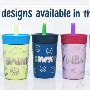 May include: Five colorful plastic tumblers with lids and straws, each featuring a unique design and a personalized name in silver lettering. The text 'more designs available in the shop' is displayed at the top of the image above the cups.