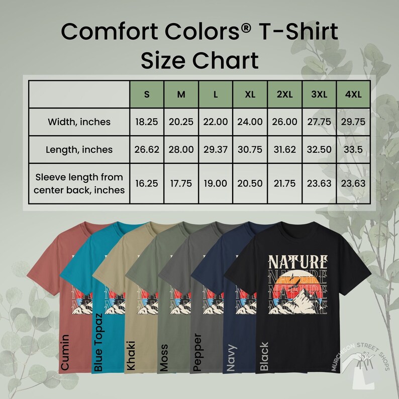 K&ouml;nnte beinhalten: Eine Gr&ouml;&szlig;entabelle f&uuml;r Comfort Colors T-Shirts zeigt Ma&szlig;e in Zoll f&uuml;r Breite, L&auml;nge und &Auml;rmell&auml;nge. Darunter sind sechs T-Shirts in verschiedenen Farben, darunter Schwarz, Marine und Khaki, jeweils mit einem Berg- und Sonnenuntergangsmotiv.