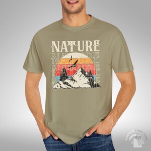 Adventure Wear Collection Mountain Print Design Vintage Style Pattern Nature Inspired Graphics Sustainable Cotton Blend Material Comfortable Outdoor Fashion Retro Wilderness Theme Perfect Gift Option Classic Casual Style Daily Wear