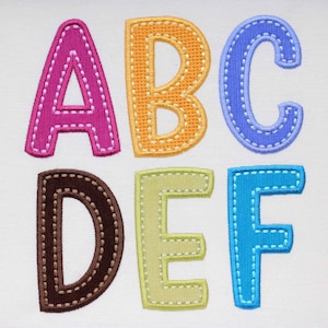 May include: Six felt letters, A, B, C, D, E, and F, in various colors, with a stitched outline. The letters are arranged in two rows of three.