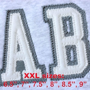 May include: White fabric letters "A" and "B" with gray stitched borders, displayed on a light gray background. The text "XXL sizes: 6.5", 7", 7.5", 8", 8.5", 9"" is in red. The letters are likely patches.