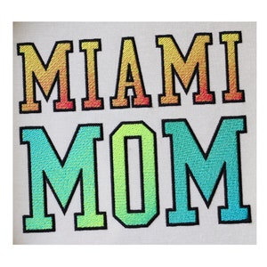 May include: Embroidered patch with the text "MIAMI MOM" in rainbow colors. The letters are outlined in black.