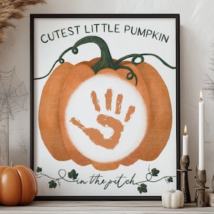 May include: A printable pumpkin handprint art print with the text "Cutest Little Pumpkin in the Patch". The print features a handprint in the center of a pumpkin.