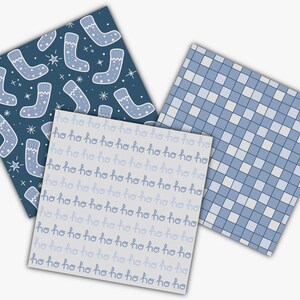 May include: Three square patterned papers. One has a dark blue background with light blue Christmas stockings and stars. Another has a light gray background with the text "ho ho ho" in a repeating pattern. The third has a blue and white checkered pattern.