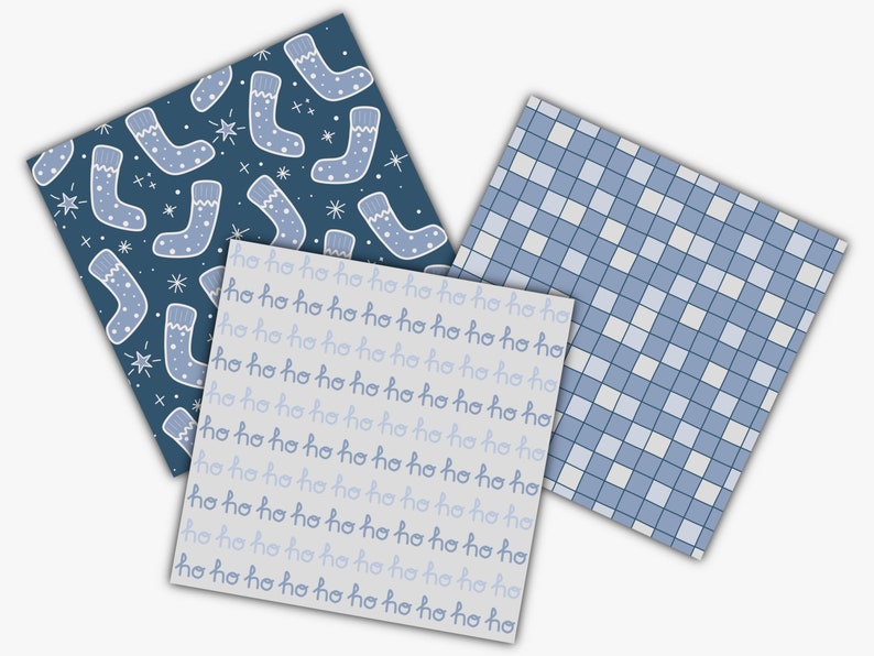 May include: Three square patterned papers. One has a dark blue background with light blue Christmas stockings and stars. Another has a light gray background with the text "ho ho ho" in a repeating pattern. The third has a blue and white checkered pattern.