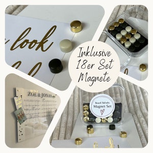 May include: A set of 18 magnetic round discs in black, white, and gold. The magnets are in a clear plastic container with a label that says "Wunsch Kalender Magnet Set" with a heart symbol. The magnets are shown on a white surface with a gold, white, and black patterned background.