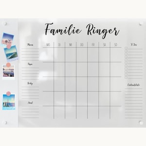 May include: White dry-erase board with a black grid and the text "Familie Ringer" at the top. The board has a column for each day of the week, and a section for "To Dos" and "Einkaulsliste".