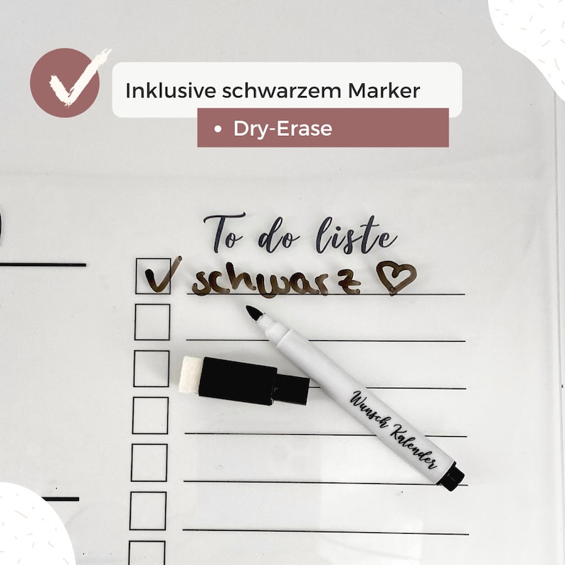 May include: White dry-erase calendar with a to-do list that says "To do liste schwarz" with a heart drawn next to it. A black dry-erase marker is on top of the calendar with the words "Wunsch Kalender" written on it. A black eraser is next to the marker.