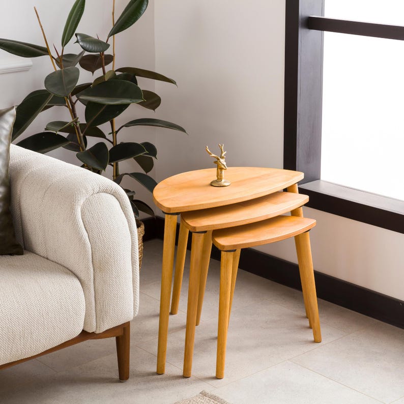 🌰 Nesting End Side Coffee Table Set of 3 – Walnut Pine Wood | Mid-Century Modern Small Nest of Table

Bring timeless mid-century modern charm to your living space with this nesting coffee table set of 3.
Crafted from premium pine wood with a rich walnut finish, these tables are designed for style, durability, and versatility — perfect for small spaces, living rooms, or as side tables by the sofa.