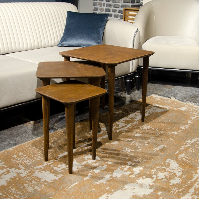 Here’s Square Walnut Wood Nesting End Table Set of 3! This Small Side Coffee Table will be absolutely fantastic Furniture Decor in your home. Your living room underwent a transformation with the addition of a Mid Century Modern style