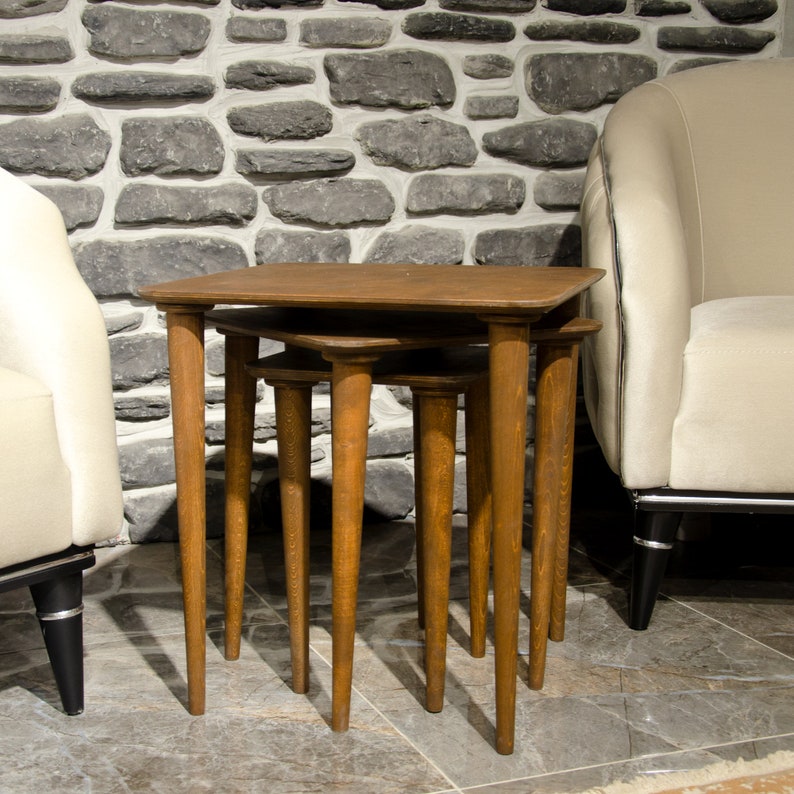 Here’s Square Walnut Wood Nesting End Table Set of 3! This Small Side Coffee Table will be absolutely fantastic Furniture Decor in your home. Your living room underwent a transformation with the addition of a Mid Century Modern style