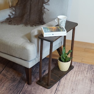 This item is Narrow Side Table near for the Livingroom Couch. It has Solid Wood and handmade for your Sofa. Our Rectangle Slim End Table has Modern design as a Coffee Table.