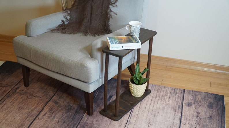 This item is Narrow Side Table near for the Livingroom Couch. It has Solid Wood and handmade for your Sofa. Our Rectangle Slim End Table has Modern design as a Coffee Table.