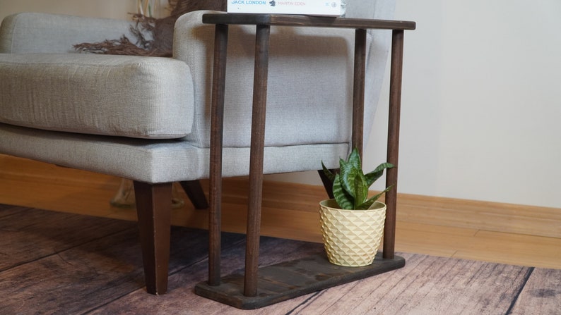 This item is Narrow Side Table near for the Livingroom Couch. It has Solid Wood and handmade for your Sofa. Our Rectangle Slim End Table has Modern design as a Coffee Table.