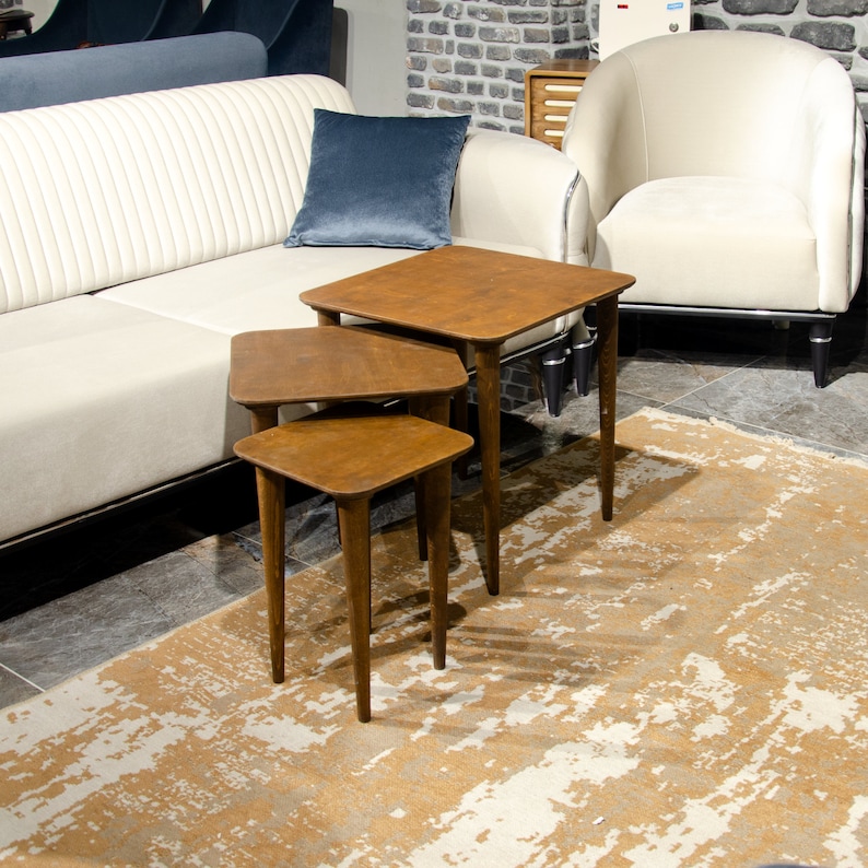 Walnut Wood Nesting End Table Set of 3

Small Side Coffee Table | Mid Century Modern Square Nest Table | Livingroom Furniture

Create a stylish and functional living space with this walnut wood nesting end table set. Perfect for small living rooms, apartments, or cozy corners, these tables save space while adding a modern mid-century charm.

You can purchase the tables as a set of 3, as a single table, or as a pair. Simply select your preferred option from the dropdown menu.