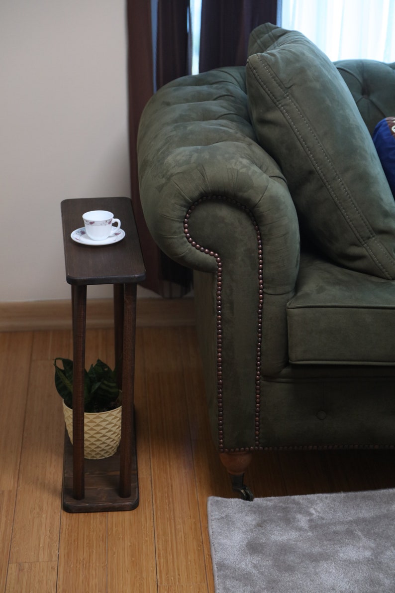 This item is Narrow Side Table near for the Livingroom Couch. It has Solid Wood and handmade for your Sofa. Our Rectangle Slim End Table has Modern design as a Coffee Table.