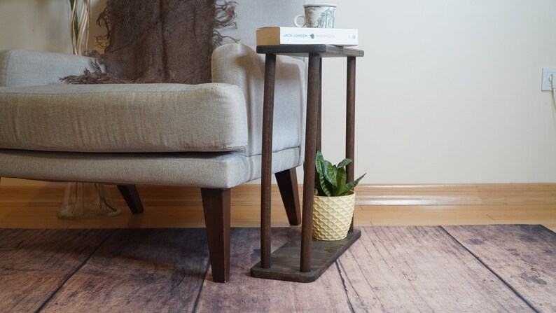 This item is Narrow Side Table near for the Livingroom Couch. It has Solid Wood and handmade for your Sofa. Our Rectangle Slim End Table has Modern design as a Coffee Table.