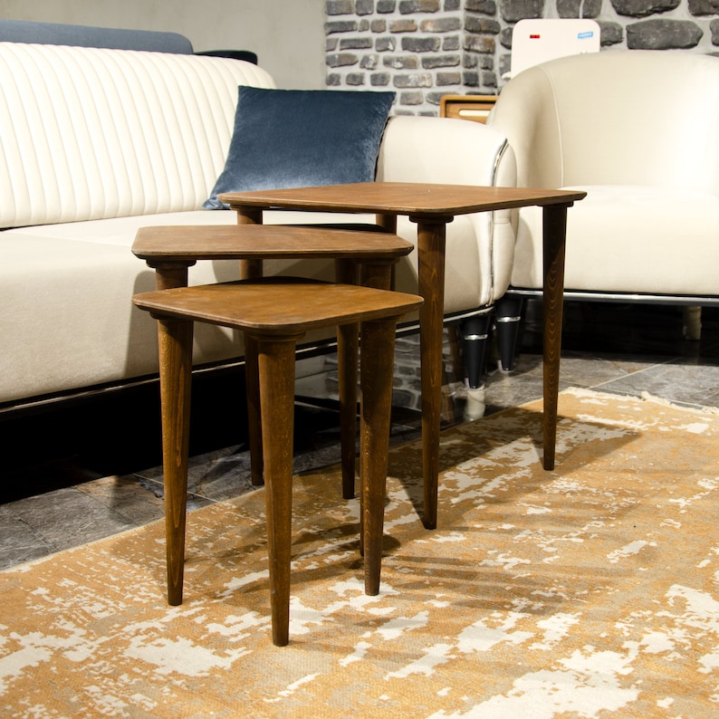 Here’s Square Walnut Wood Nesting End Table Set of 3! This Small Side Coffee Table will be absolutely fantastic Furniture Decor in your home. Your living room underwent a transformation with the addition of a Mid Century Modern style