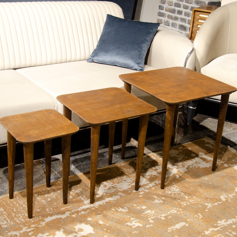 Here’s Square Walnut Wood Nesting End Table Set of 3! This Small Side Coffee Table will be absolutely fantastic Furniture Decor in your home. Your living room underwent a transformation with the addition of a Mid Century Modern style