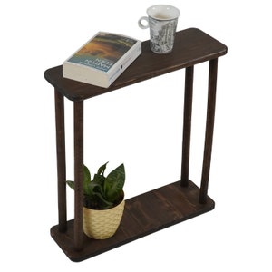 This item is Narrow Side Table near for the Livingroom Couch. It has Solid Wood and handmade for your Sofa. Our Rectangle Slim End Table has Modern design as a Coffee Table.