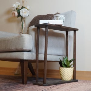 This item is Narrow Side Table near for the Livingroom Couch. It has Solid Wood and handmade for your Sofa. Our Rectangle Slim End Table has Modern design as a Coffee Table.