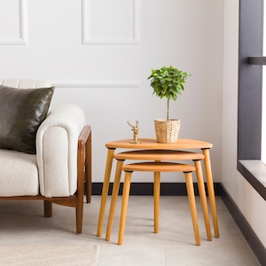 🌰 Nesting End Side Coffee Table Set of 3 – Walnut Pine Wood | Mid-Century Modern Small Nest of Table

Bring timeless mid-century modern charm to your living space with this nesting coffee table set of 3.
Crafted from premium pine wood with a rich walnut finish, these tables are designed for style, durability, and versatility — perfect for small spaces, living rooms, or as side tables by the sofa.