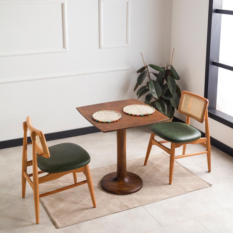 We combine rounded square dining table for two with tulip leg. Here is dark walnut wood 2 to 4 person dining room table as a kitchen furniture! This table with tulip leg will be absolutely fantastic small space table in your kitchen or apartment.