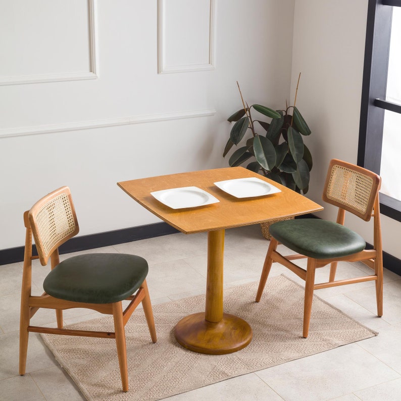 We combine rounded square dining table for two with tulip leg. Here is dark walnut wood 2 to 4 person dining room table as a kitchen furniture! This table with tulip leg will be absolutely fantastic small space table in your kitchen or apartment.
