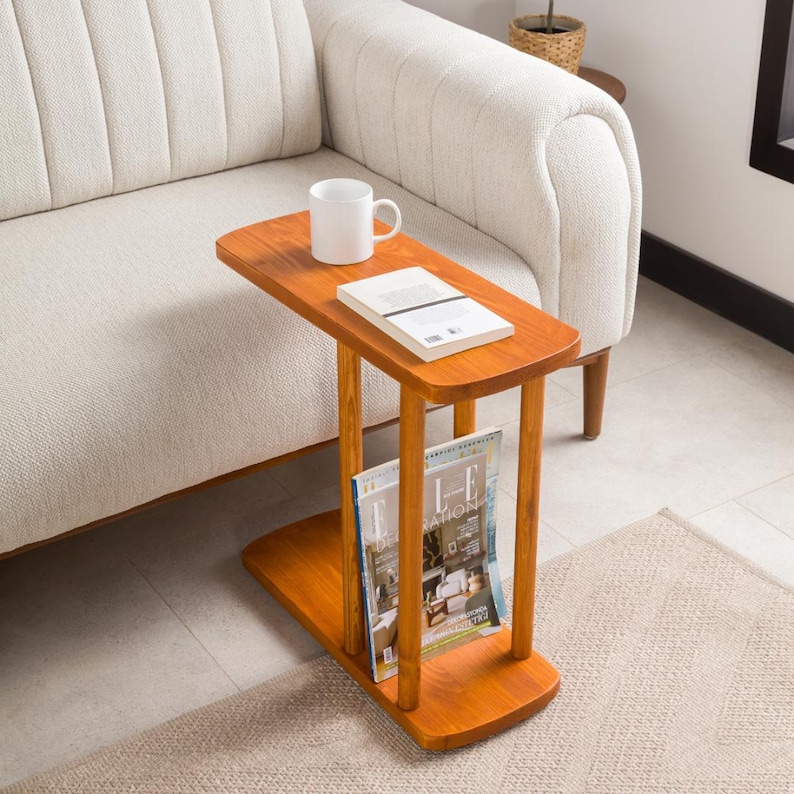 Narrow End Side Coffee Table with Storage

C Shape Couch Side Table | Solid Pine Wood Sofa End Table | Small Space Living Room Furniture

Designed for modern living and small spaces, this C shape narrow side table with storage combines elegance, durability, and functionality. Its slim profile allows it to slide easily under your couch or sofa, making it perfect for compact areas.