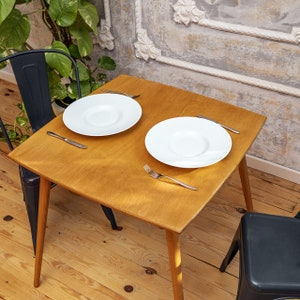 We combine Square Oak Wood Dining Table with   Mid Century Modern Rustic Dine Table. Here is 2 Person Space Saving Breakfast Kitchen Table Furniture for your Home! This oak wood dine table will be absolutely fantastic space saving table