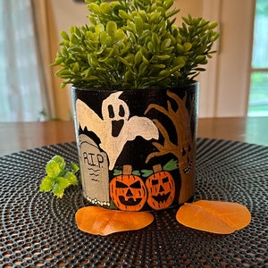 Hand-painted Halloween themed vase with faux ivy.