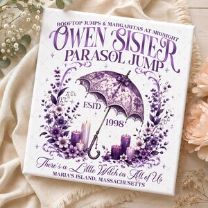 May include: A rectangular white canvas print featuring purple text and graphics. The text reads "OWEN SISTER PARASOL JUMP" and "There's a Little Witch in All of Us". It includes a detailed purple parasol, purple floral arrangements, and candles.
