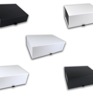 May include: Five gift boxes, two black and three white, with a drawer-style opening. The boxes are made of sturdy cardboard and have a sleek, modern design.