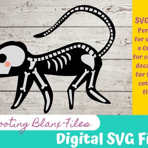 May include: Black and white skeleton monkey graphic for use with a Cricut or laser cutting machine. The image is on a white wood background with the text "Shooting Blank Files" and "Digital SVG File".