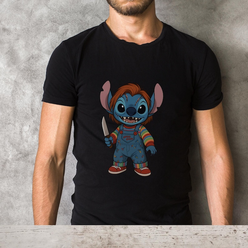 May include: Black t-shirt featuring a cartoon character mashup of Stitch and Chucky. The blue Stitch character has red hair and is holding a knife. He is wearing blue overalls with a rainbow striped shirt underneath.