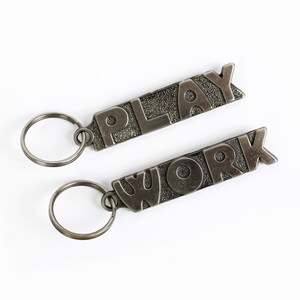 Vintage 1970&#39;s Double Sided Metal Keychain, Work and Play, 70s Bag Charms