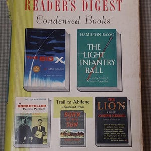 May include: A vintage Reader's Digest Condensed Books cover featuring several book titles. The cover has a yellow and red color scheme with the text "Reader's Digest Condensed Books" at the top. Titles include "The Big X" and "The Light Infantry Ball."