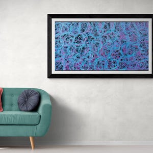 May include: Abstract art print with a black frame. The print features a swirling pattern of blue and purple lines.