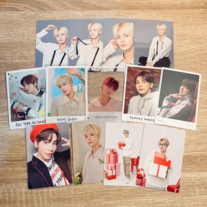 May include: A collection of photo cards featuring a young man in various poses. The cards are printed on white cardstock and have a glossy finish. Some of the cards feature the text "I love you" and "7mens" in Korean.